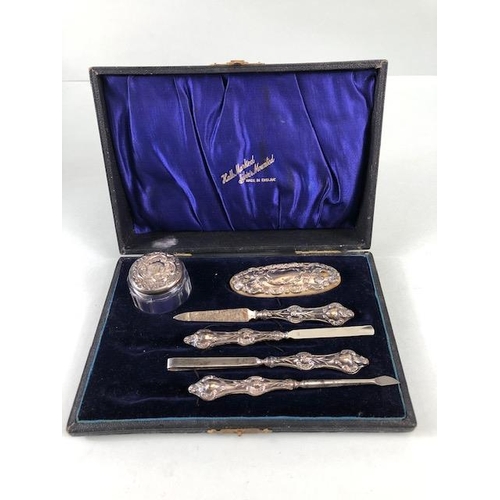 27 - Hallmarked silver mounted and boxed manicure set hallmarked for Birmingham by maker G & C Ltd