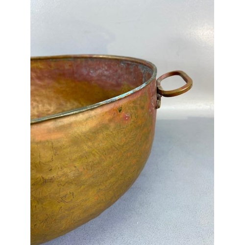 315 - Copper Pan, large deep hand planished copper pan with twin brass handles approximately 44cm across