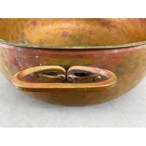 315 - Copper Pan, large deep hand planished copper pan with twin brass handles approximately 44cm across