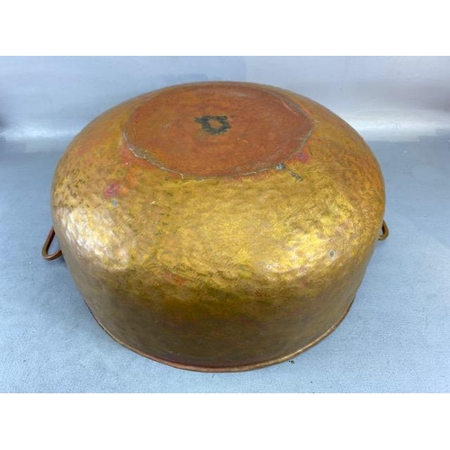 315 - Copper Pan, large deep hand planished copper pan with twin brass handles approximately 44cm across