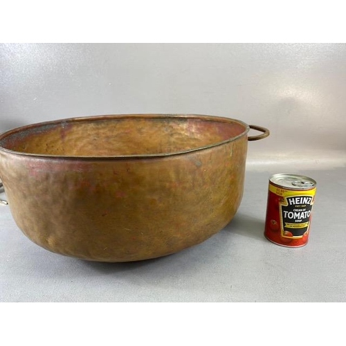 315 - Copper Pan, large deep hand planished copper pan with twin brass handles approximately 44cm across