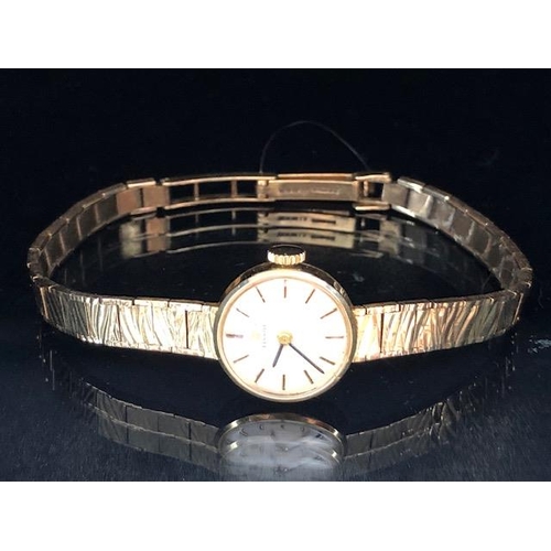 33A - 9ct yellow gold ladies Tissot watch on 9ct tapered bark finish bracelet  approximately 14.98g total,... 