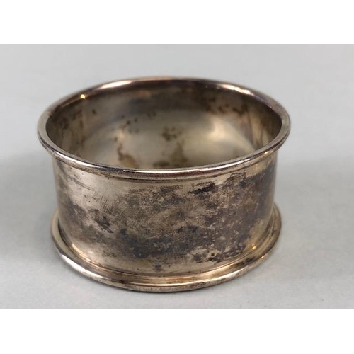 38 - Hallmarked silver items to include napkin ring, fork and interesting shaped spoon total weight appro... 