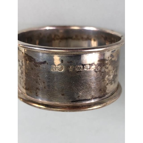 38 - Hallmarked silver items to include napkin ring, fork and interesting shaped spoon total weight appro... 