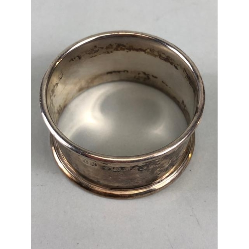 38 - Hallmarked silver items to include napkin ring, fork and interesting shaped spoon total weight appro... 