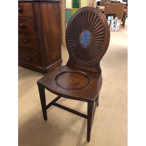 385 - Early 19th century mahogany hall chair with oval rosette back with painted Armorial, scoop seat on t... 