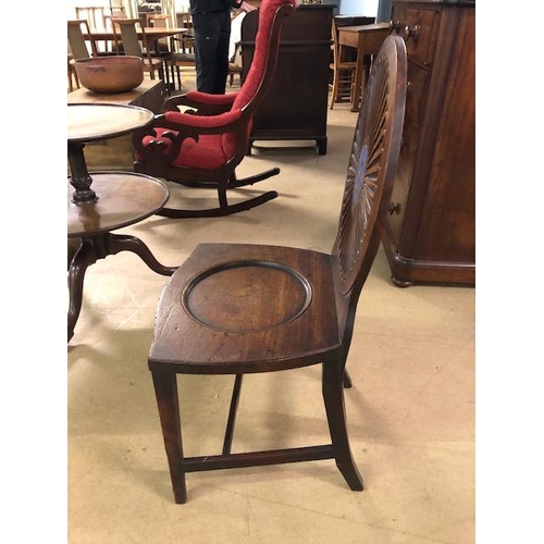 385 - Early 19th century mahogany hall chair with oval rosette back with painted Armorial, scoop seat on t... 