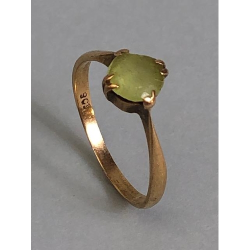 38A - 9ct marked  yellow gold ring set with a pale green stone approximately 1.59g size O 1/2