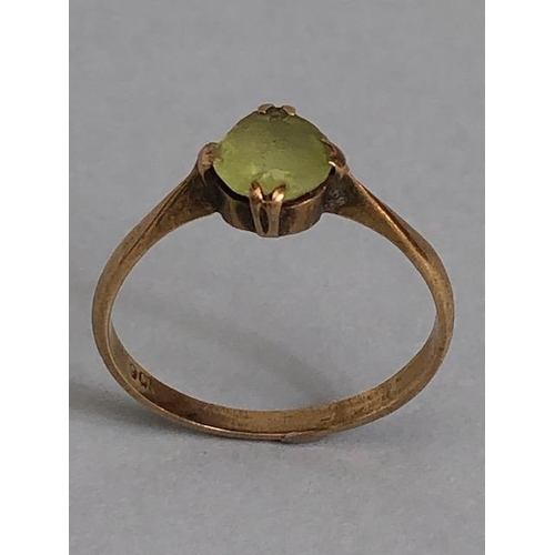 38A - 9ct marked  yellow gold ring set with a pale green stone approximately 1.59g size O 1/2