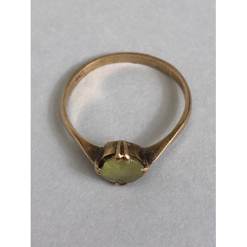 38A - 9ct marked  yellow gold ring set with a pale green stone approximately 1.59g size O 1/2