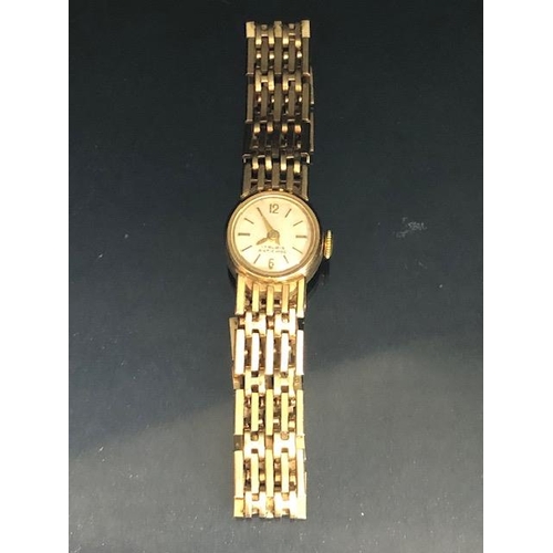 4 - 9ct Gold Ladies wristwatch with 9ct Gold gate link bracelet strap, the watch face marked 17 RUBIS AN... 