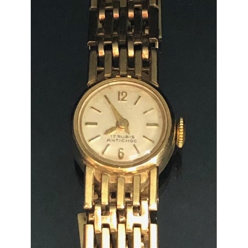 4 - 9ct Gold Ladies wristwatch with 9ct Gold gate link bracelet strap, the watch face marked 17 RUBIS AN... 