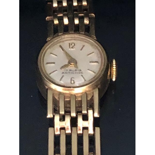 4 - 9ct Gold Ladies wristwatch with 9ct Gold gate link bracelet strap, the watch face marked 17 RUBIS AN... 