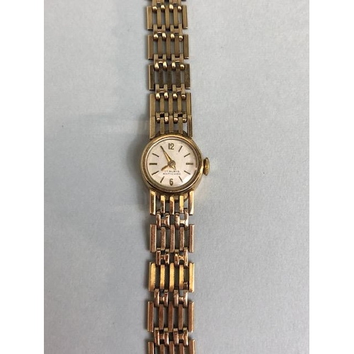 4 - 9ct Gold Ladies wristwatch with 9ct Gold gate link bracelet strap, the watch face marked 17 RUBIS AN... 