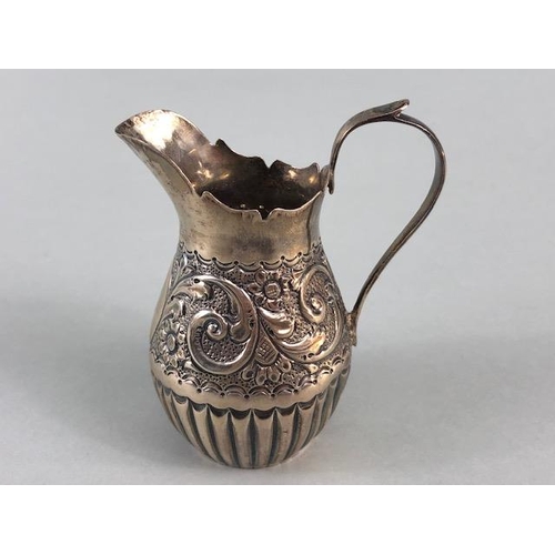 5 - Victorian Silver hallmarked cream jug with repousse design and lower half fluted design hallmarked f... 