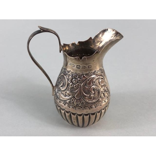 5 - Victorian Silver hallmarked cream jug with repousse design and lower half fluted design hallmarked f... 