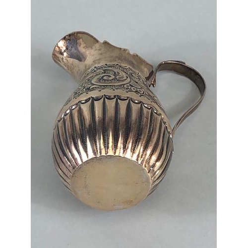 5 - Victorian Silver hallmarked cream jug with repousse design and lower half fluted design hallmarked f... 