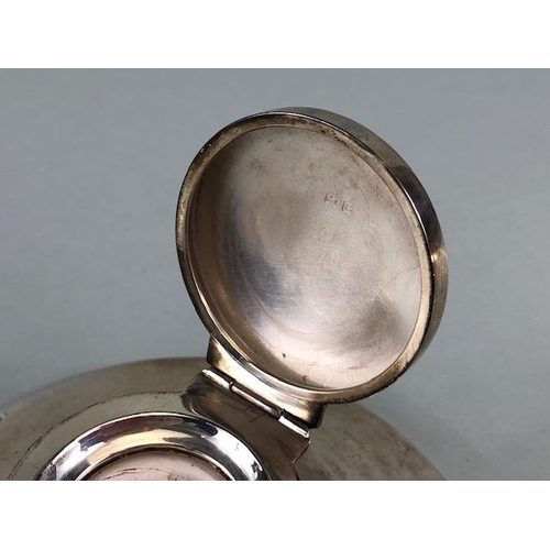 50 - Silver hallmarked large circular based ink well with hinged lid and glass inset, the filled base app... 