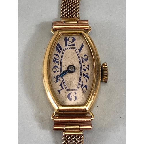 53 - 18ct ladies dress watch early 20th century, rounded lozenge shape with Arabic numerals on 9ct mesh b... 