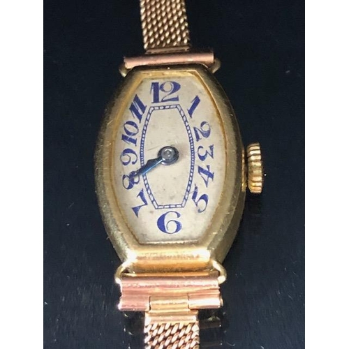 53 - 18ct ladies dress watch early 20th century, rounded lozenge shape with Arabic numerals on 9ct mesh b... 