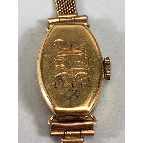 53 - 18ct ladies dress watch early 20th century, rounded lozenge shape with Arabic numerals on 9ct mesh b... 