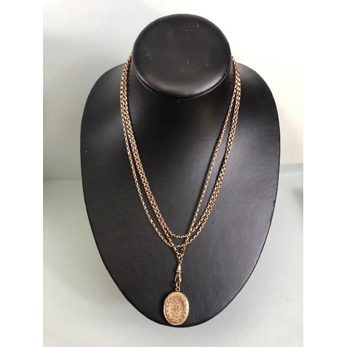 54 - 9ct Gold very long (approx 140cm) chain with a gold coloured Locket (total weight approx 27g)