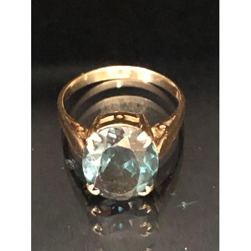 60a - 9ct Gold ring set with a synthetic translucent Green gemstone in a four claw setting, size approx 'L... 