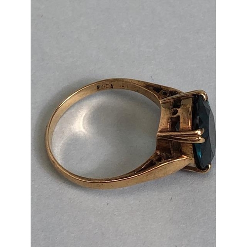 60a - 9ct Gold ring set with a synthetic translucent Green gemstone in a four claw setting, size approx 'L... 