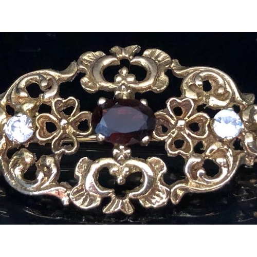 62a - 9ct Gold pierced brooch set with gemstones of a Victorian style approx 35mm x 20mm & 4.4g