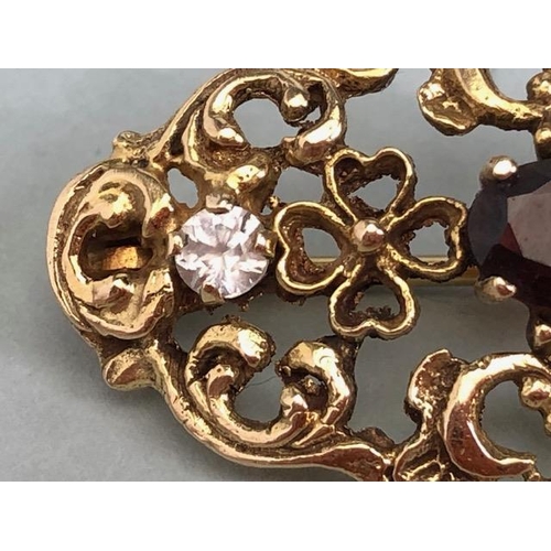 62a - 9ct Gold pierced brooch set with gemstones of a Victorian style approx 35mm x 20mm & 4.4g