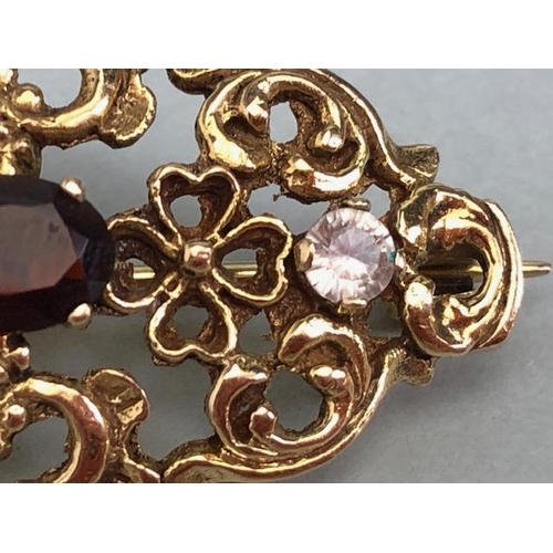 62a - 9ct Gold pierced brooch set with gemstones of a Victorian style approx 35mm x 20mm & 4.4g