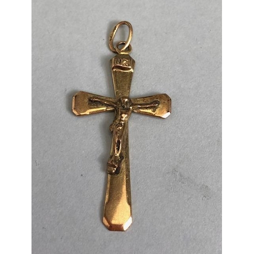 64 - Three items of 9ct Gold jewellery to include a cross/ crucifix pendant and a child's signet ring (3)... 