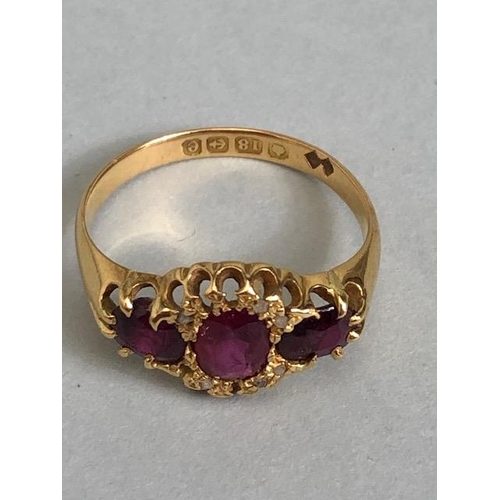 65a - 18ct Gold ring set with diamonds and red/ pink gemstones size 'O' and 3g