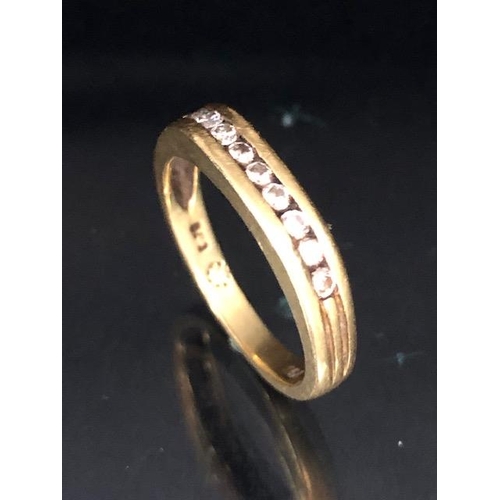 66 - 18ct Gold contemporary style ring set with band of 9 diamonds flanked with fluted shoulders size app... 