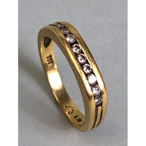 66 - 18ct Gold contemporary style ring set with band of 9 diamonds flanked with fluted shoulders size app... 