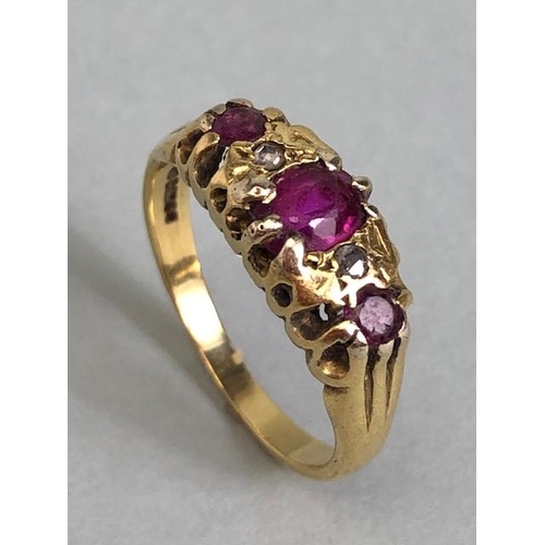 67a - 18ct Gold ring set with red/pink gemstones size approx 'L' & 3.7g