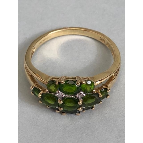 68 - 9ct Gold ring set with green Tourmaline gemstones with pierced shoulders size approx 'M'