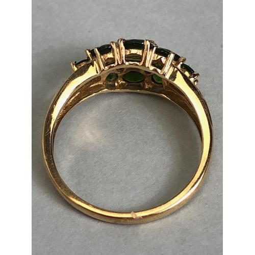 68 - 9ct Gold ring set with green Tourmaline gemstones with pierced shoulders size approx 'M'