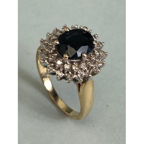 69 - 9ct Gold Sapphire and Diamond cluster ring the central faceted Sapphire approx 7.5 x 9mm and size 'N... 