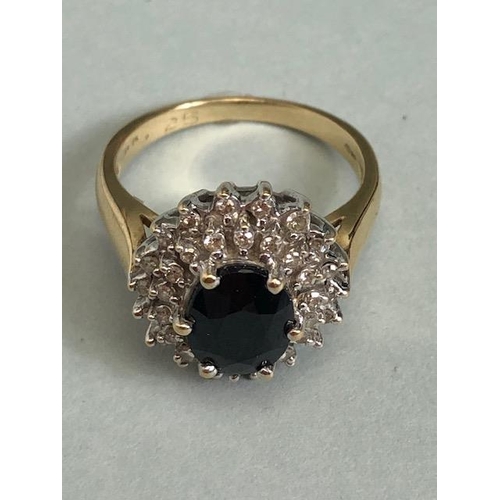 69 - 9ct Gold Sapphire and Diamond cluster ring the central faceted Sapphire approx 7.5 x 9mm and size 'N... 