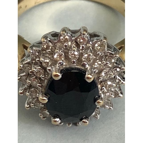 69 - 9ct Gold Sapphire and Diamond cluster ring the central faceted Sapphire approx 7.5 x 9mm and size 'N... 