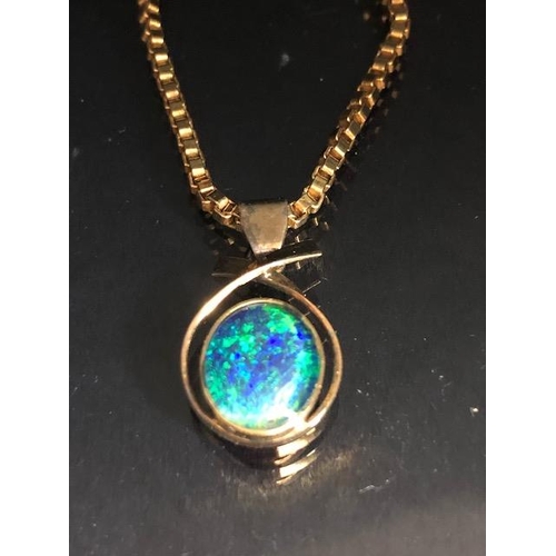 88 - Jewellery, a yellow metal triplet opal pendant on a yellow metal box chain and a yellow metal filigr... 