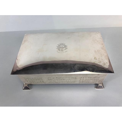 10 - Large Silver hallmarked cigarette box on arrow feet, with cedar lining, crest to lid and names engra... 