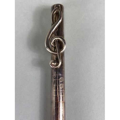 107 - Silver Hallmarked Tiffany & Co ball point pen, the pocket clip fashioned as a treble clef, with a fa... 