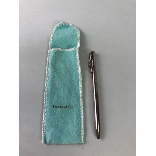 107 - Silver Hallmarked Tiffany & Co ball point pen, the pocket clip fashioned as a treble clef, with a fa... 