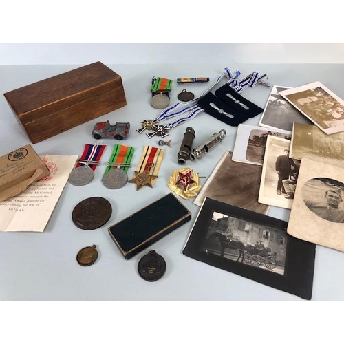 110 - Military interest, collection of military, and civil medals badges, photos and associated items