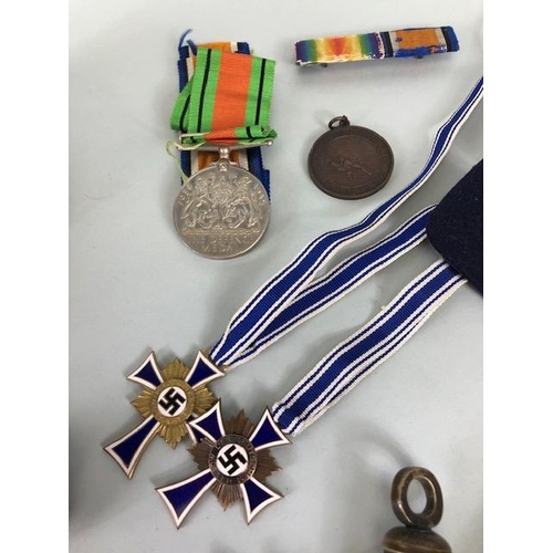 110 - Military interest, collection of military, and civil medals badges, photos and associated items