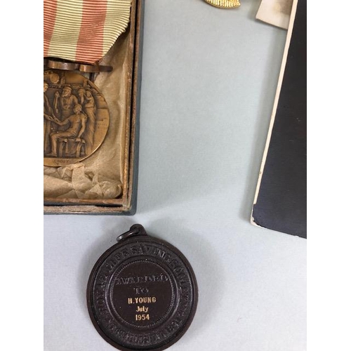 110 - Military interest, collection of military, and civil medals badges, photos and associated items