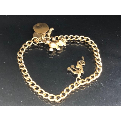 112 - 9ct Gold bracelet with 9ct Gold heart shaped lock and 9ct St Christopher and musical notes total wei... 