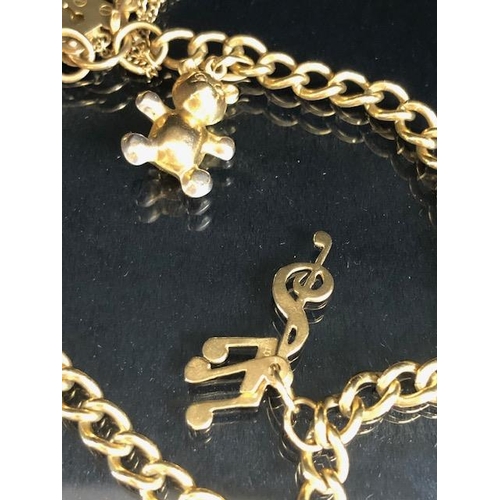 112 - 9ct Gold bracelet with 9ct Gold heart shaped lock and 9ct St Christopher and musical notes total wei... 